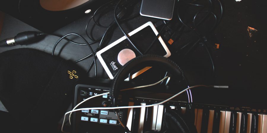 Headphones and speaker on a keyboard